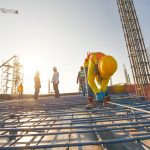 Construction workers fabricating steel reinforcement bar at the construction site